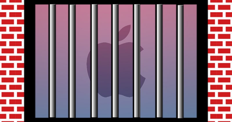 Logo Apple za kratami ceglanego więzienia.